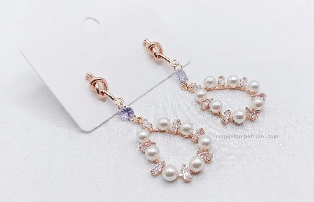 Stylish rose gold earrings for festive wear