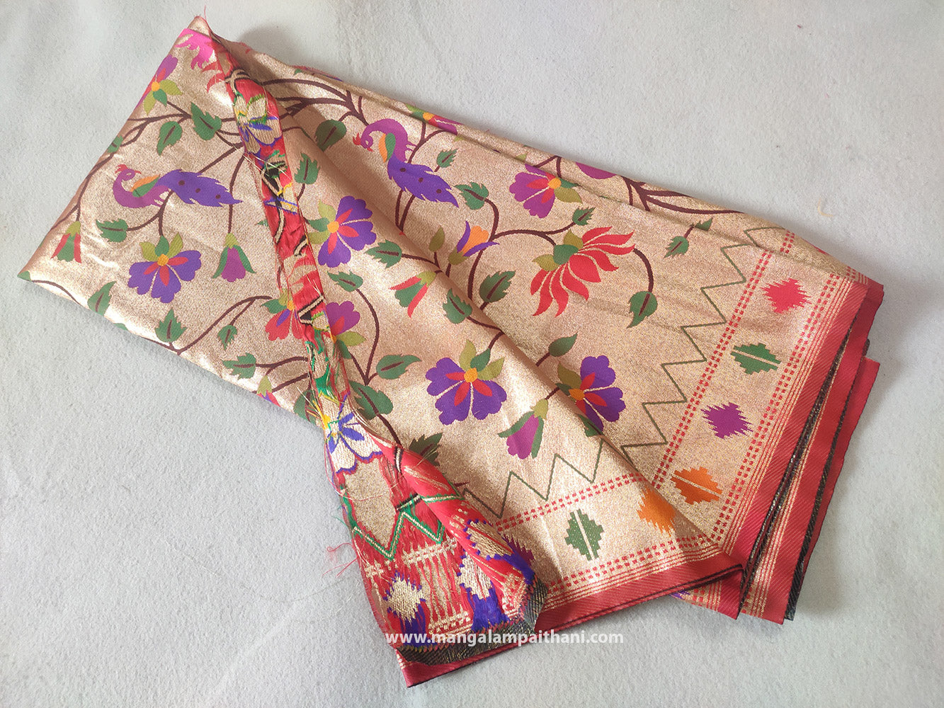 A golden zari paithani blouse piece