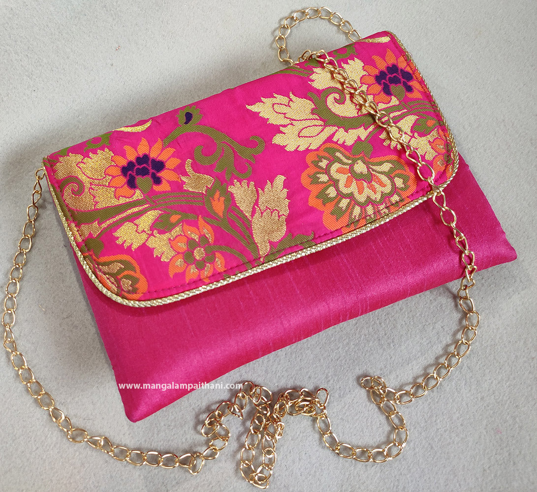 A pink clutch purse