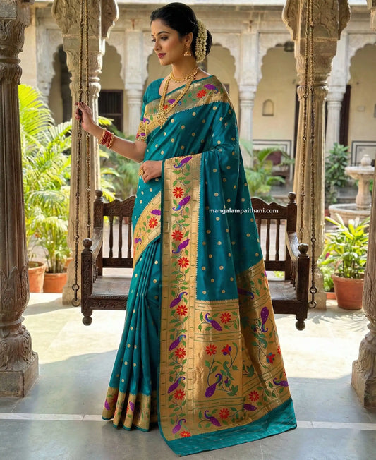 Woman in a traditional teal saree, mangalam paithani silk saree