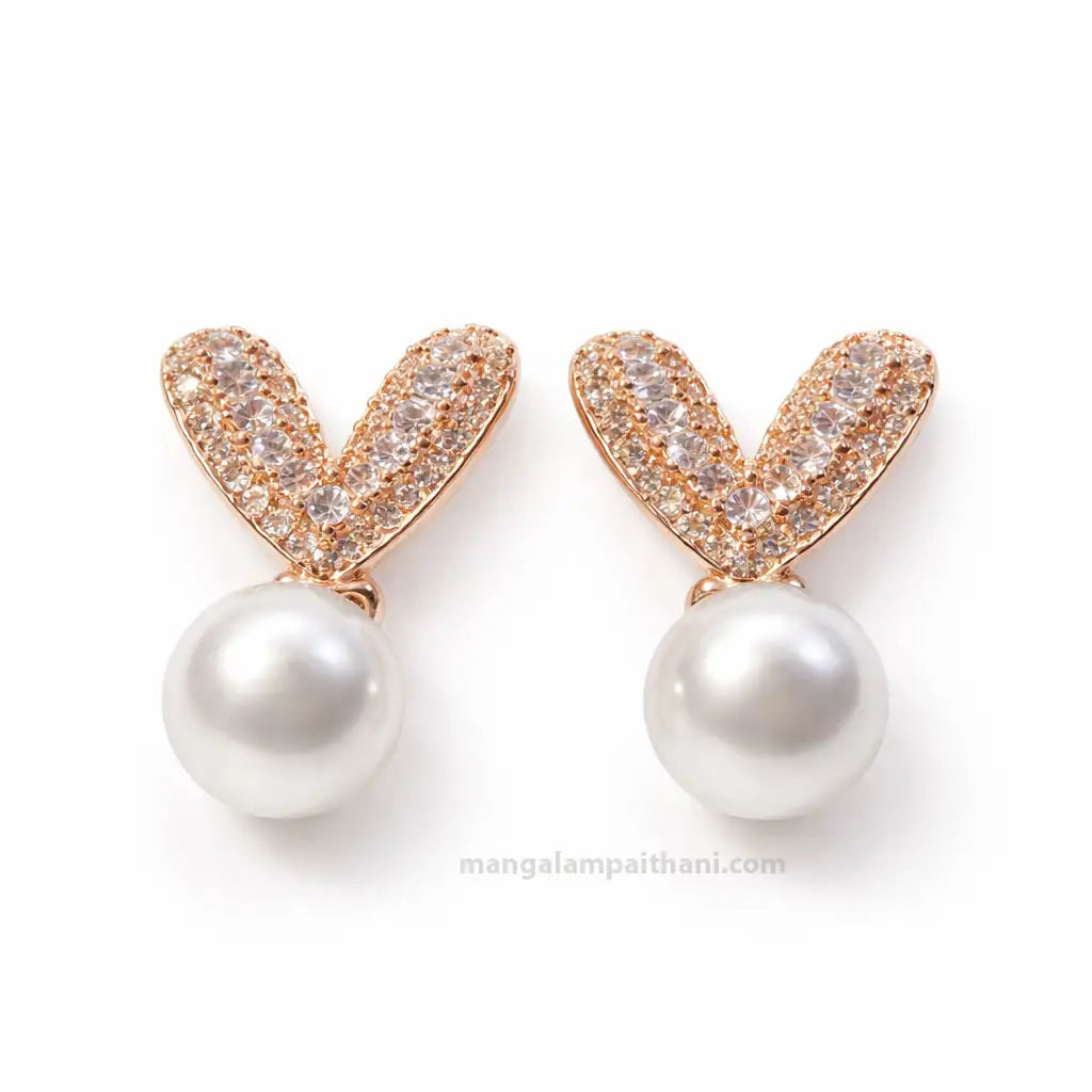 Rose gold pearl stud earrings with crystal stones