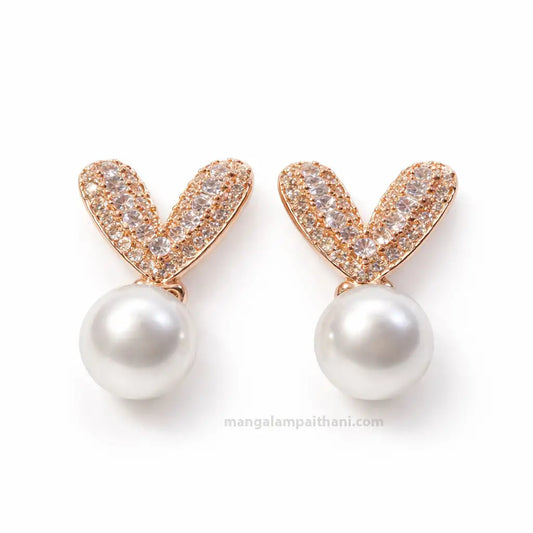 Rose gold pearl stud earrings with crystal stones