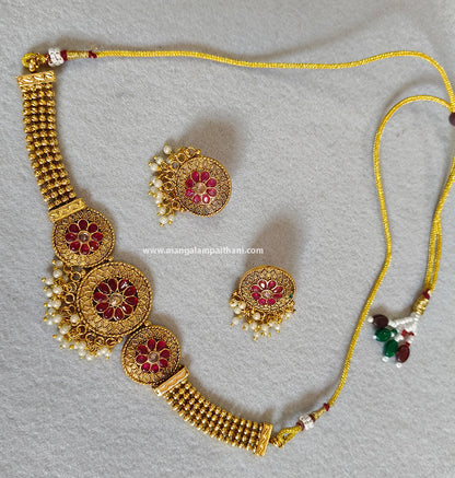 A gold-plated choker necklace set with a red and white floral design, including a necklace and a pair of earrings