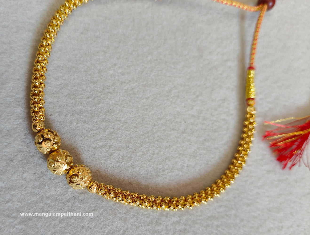 A gold-plated choker necklace