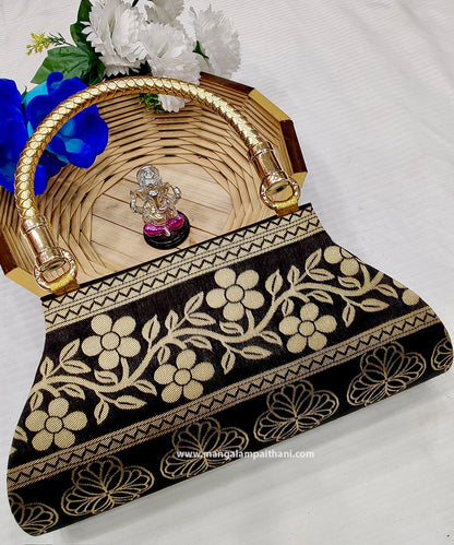 A black and gold clutch purse