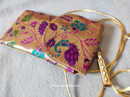 A multicolored floral Paithani mobile pouch with a zipper