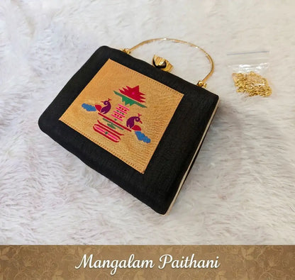 Black silk Paithani clutch with peacock motif