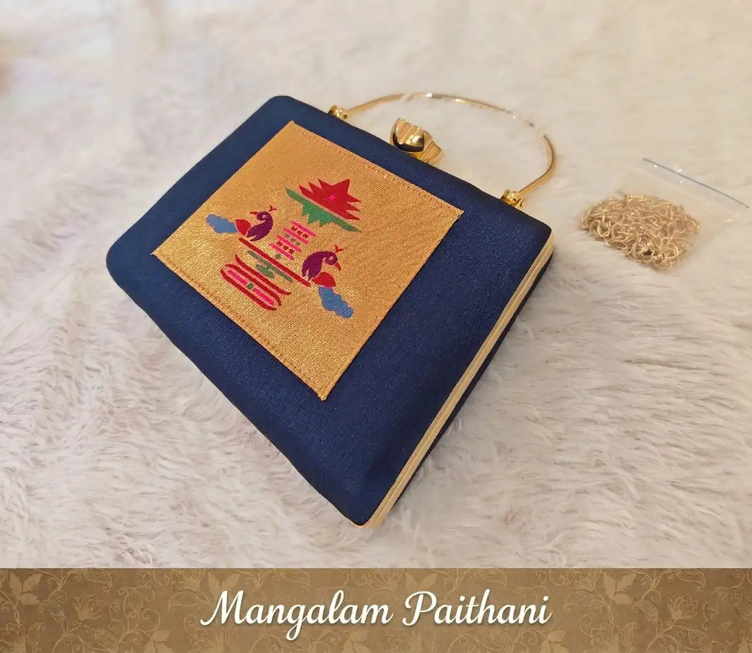 Elegant navy blue ethnic clutch with golden handle